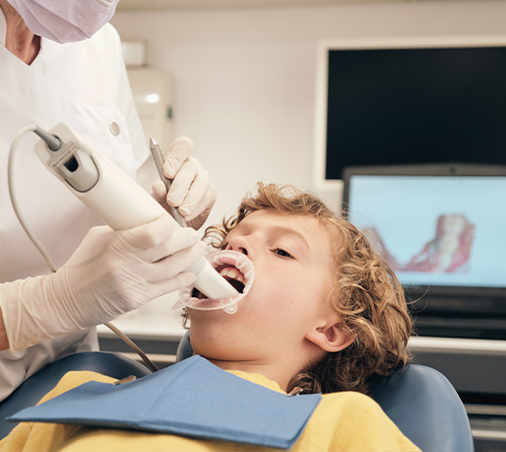 Greenfield orthodontist taking digital images of a child's mouth