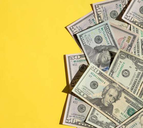 Cash on yellow background
