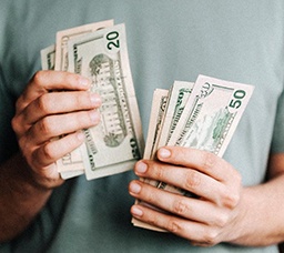 Close up of man counting cash 