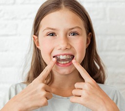 Young teen girl wearing Invisalign