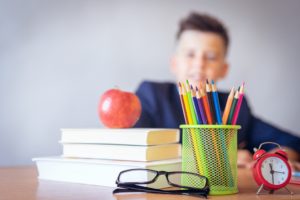 Student sitting at desk in classroom