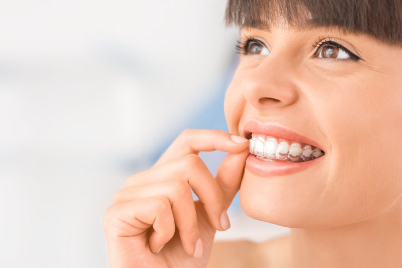 woman wearing clear aligners