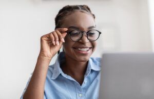 Young woman wearing glasses and braces at work